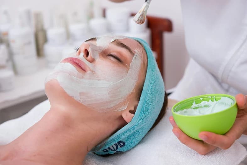 Woman receiving facial